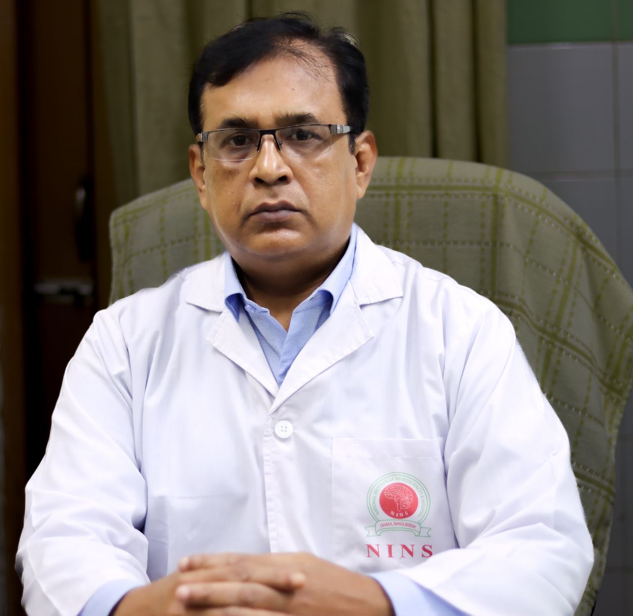 Neurosurgeon in Bangladesh — Prof. Dr. Moklasur Rahman Mukul Professional portrait of Prof. Dr. Moklasur Rahman Mukul in a clinical setting.