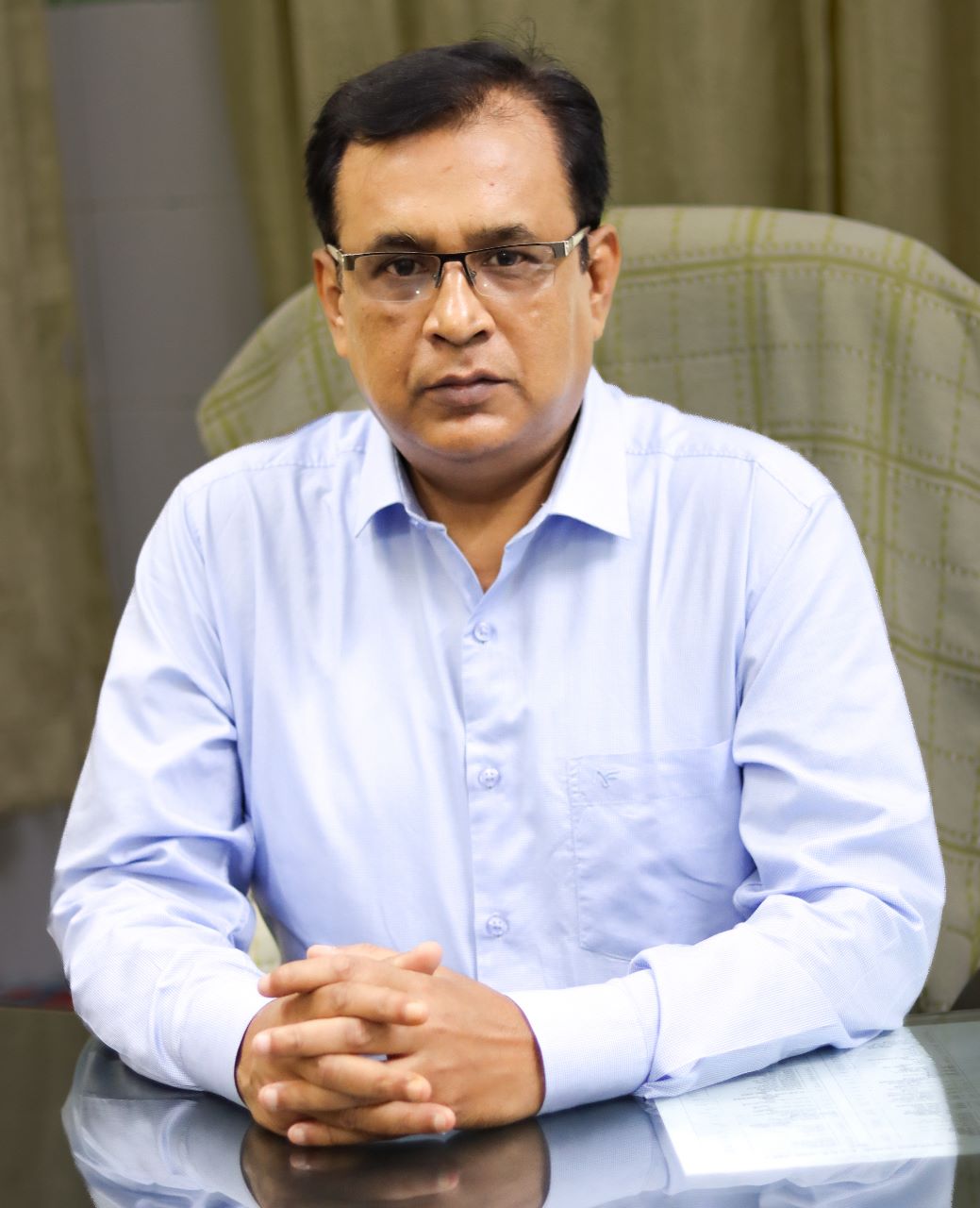Neurosurgeon in Bangladesh — Prof. Dr. Moklasur Rahman Mukul Professional portrait of Prof. Dr. Moklasur Rahman Mukul in a clinical setting.