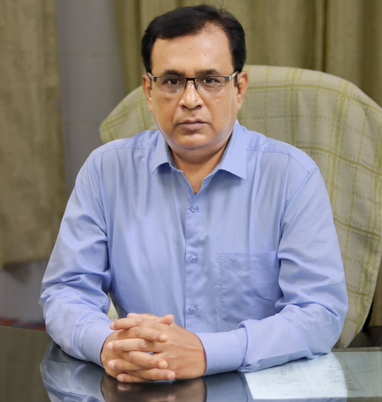 Neurosurgeon in Bangladesh — Prof. Dr. Moklasur Rahman Mukul Professional portrait of Prof. Dr. Moklasur Rahman Mukul in a clinical setting.