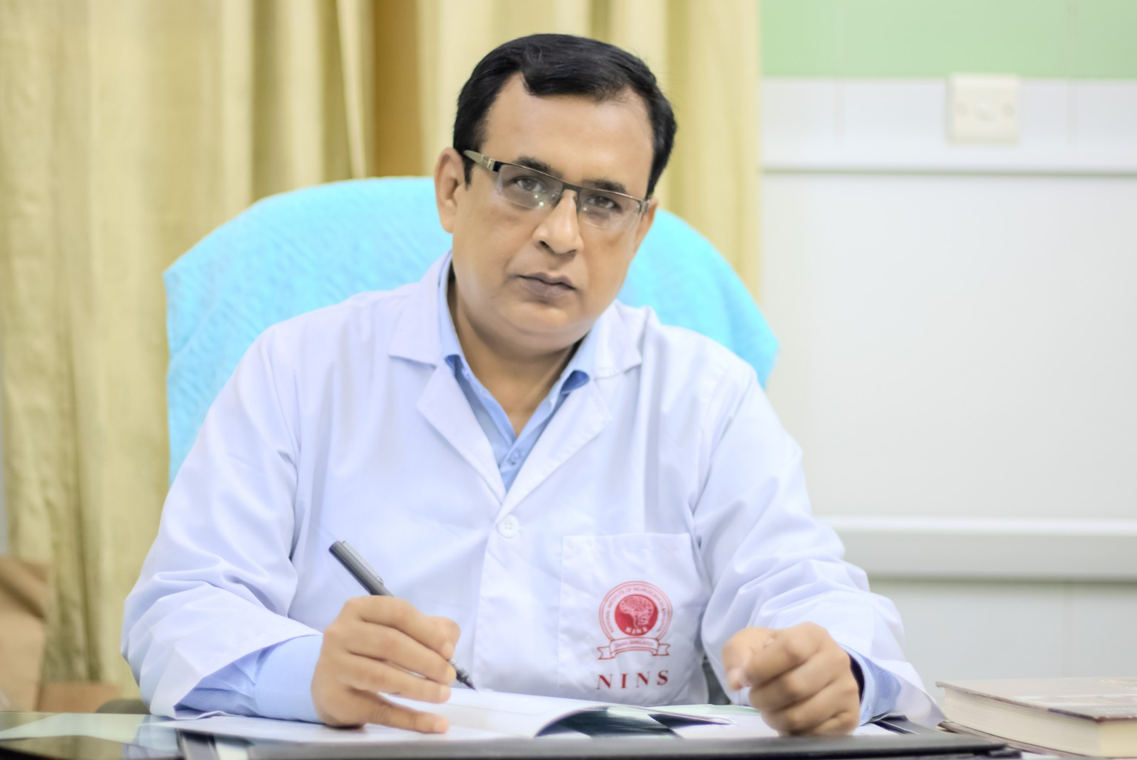 Neurosurgeon in Bangladesh — Prof. Dr. Moklasur Rahman Mukul Professional portrait of Prof. Dr. Moklasur Rahman Mukul in a clinical setting.