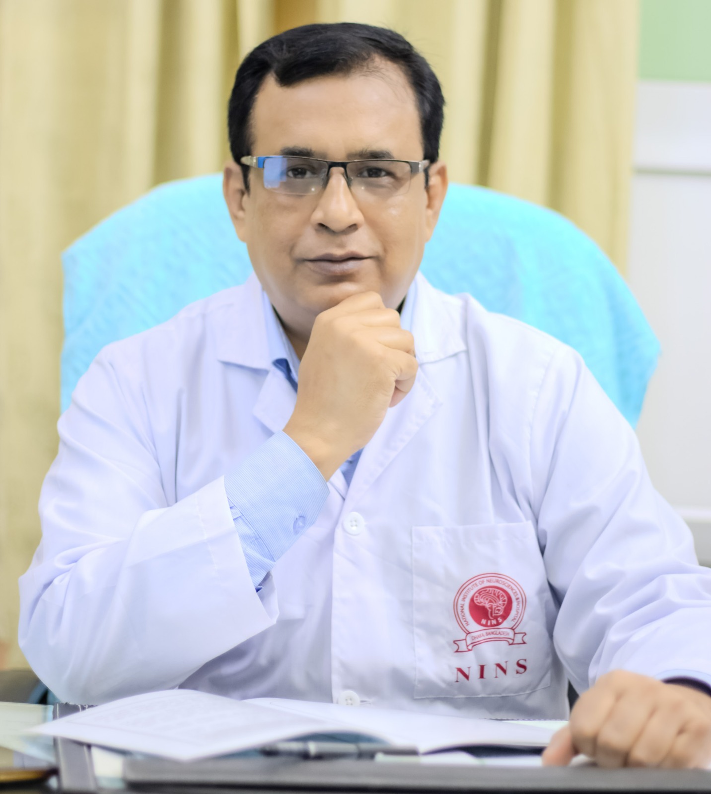Neurosurgeon in Bangladesh — Prof. Dr. Moklasur Rahman Mukul Professional portrait of Prof. Dr. Moklasur Rahman Mukul in a clinical setting.