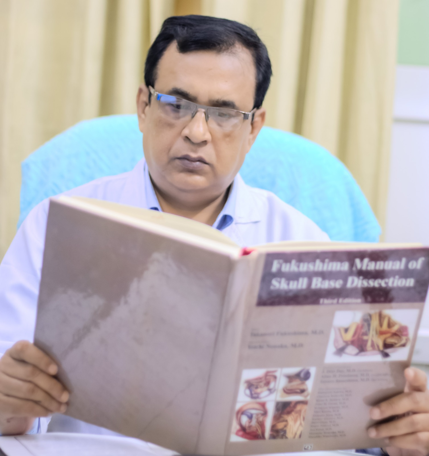 Neurosurgeon in Bangladesh — Prof. Dr. Moklasur Rahman Mukul Professional portrait of Prof. Dr. Moklasur Rahman Mukul in a clinical setting.