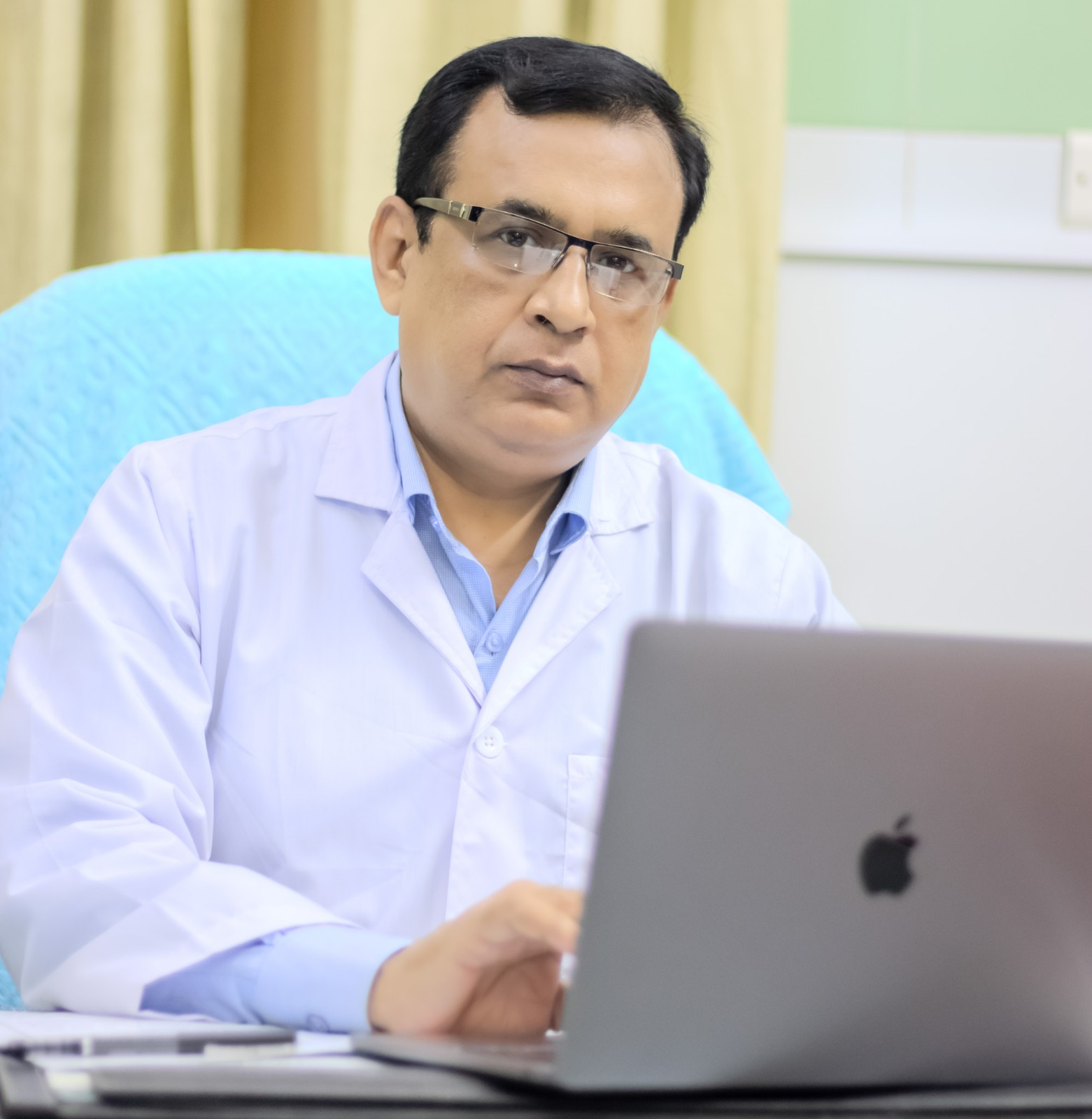 Neurosurgeon in Bangladesh — Prof. Dr. Moklasur Rahman Mukul Professional portrait of Prof. Dr. Moklasur Rahman Mukul in a clinical setting.