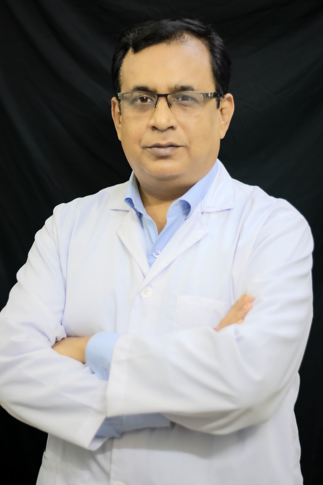 Neurosurgeon in Bangladesh — Prof. Dr. Moklasur Rahman Mukul Professional portrait of Prof. Dr. Moklasur Rahman Mukul in a clinical setting.